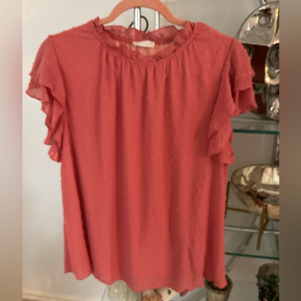 Women's Ruffled coral top, fully lined.
